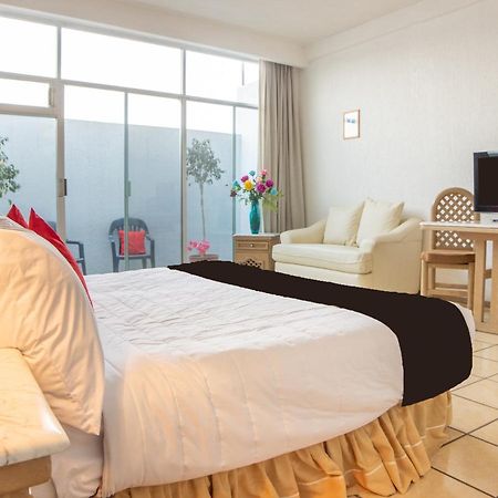 Capital O Hotel Villa Monini Пуэбла Экстерьер фото